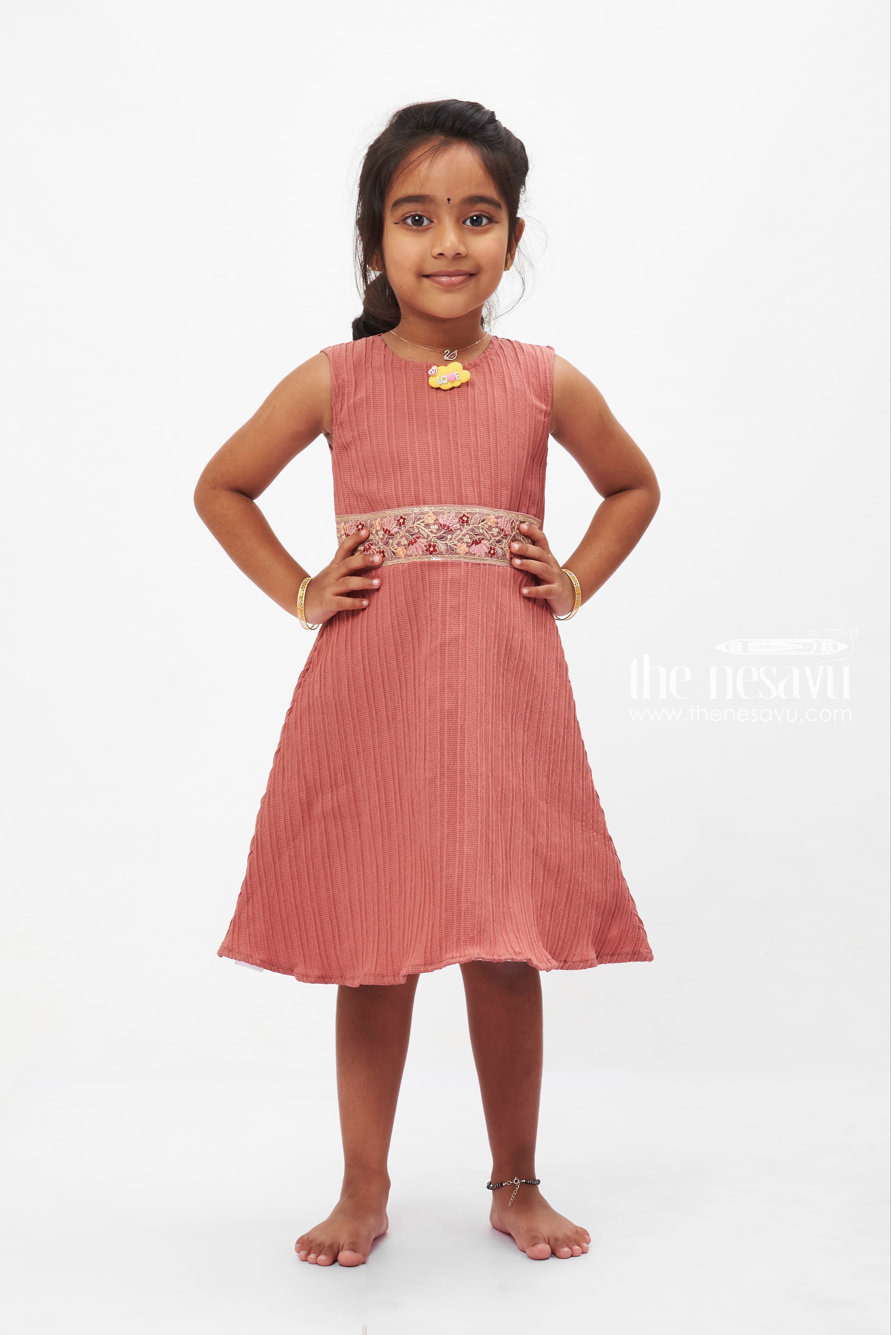 Girls Coral Pleated Dress with Floral Brooch Vibrant Party Wear