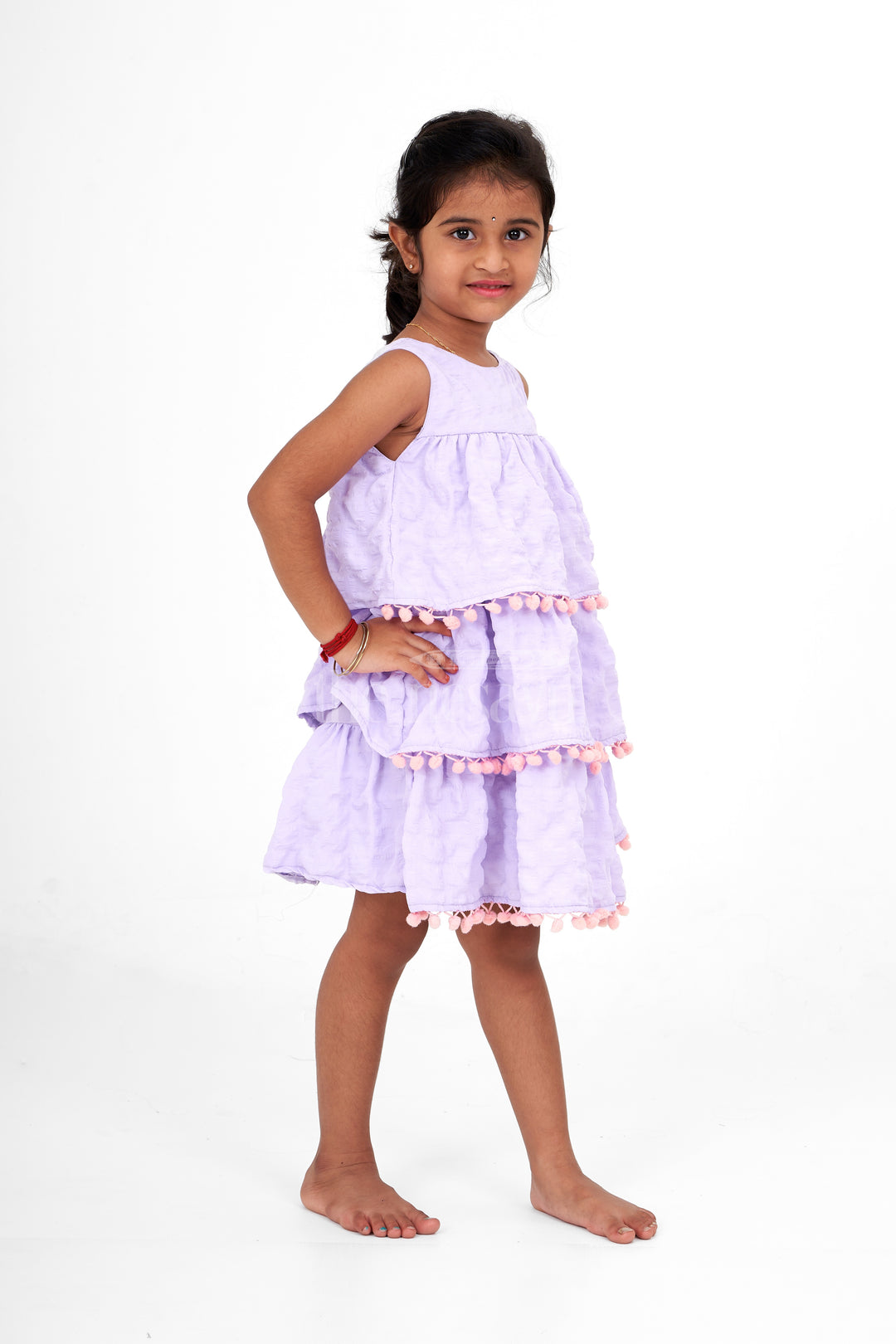 Lilac-Tiered Girls Fancy Frock with Pom-Pom Trim and Sleeveless Design for Parties