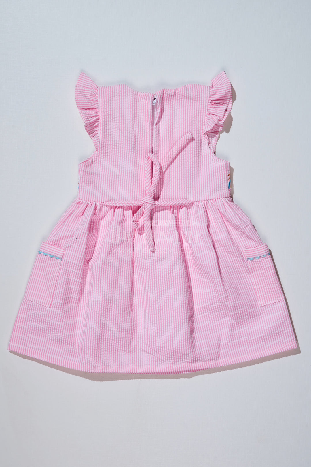 Baby Girls Pink Colour Frock in Seer Sucker Cotton with Embroidery and Ruffled Sleeves