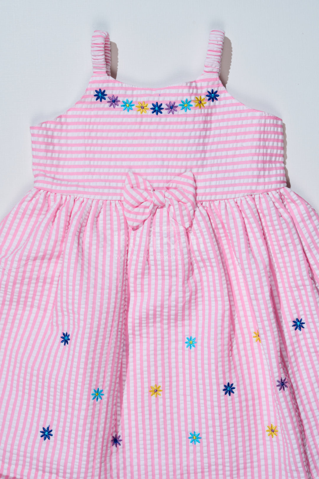 Baby Girls Pink Cotton Frock in Seer Sucker Fabric with Floral Embroidery and Bow Accent