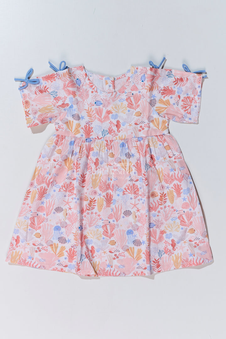 Baby Girls Peach Frock with Ocean-Inspired Print and Tie-Up Sleeves for a Charming Look