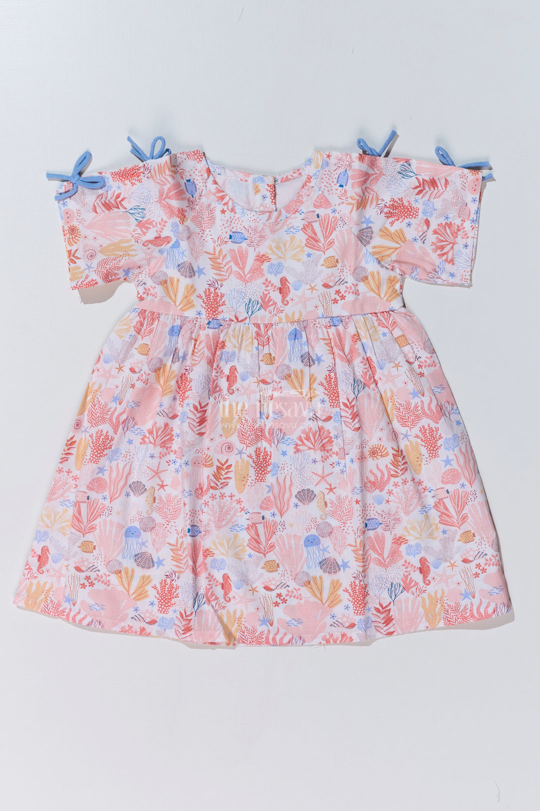 Baby Girls Peach Frock with Ocean-Inspired Print and Tie-Up Sleeves for a Charming Look