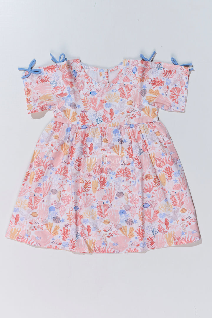 Baby Girls Peach Frock with Ocean-Inspired Print and Tie-Up Sleeves for a Charming Look