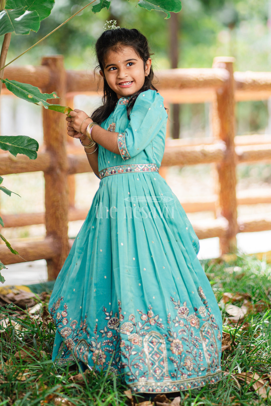 Girls Teal Party Gown with Intricate Embroidery and Floral Borders for Special Occasions