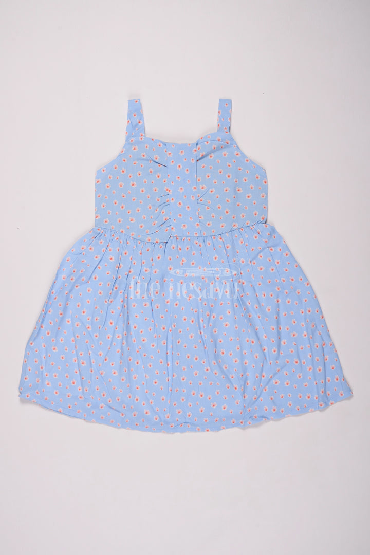 Girls Cotton Frock Online with Dainty Floral Prints in Light Blue Muslin Fabric