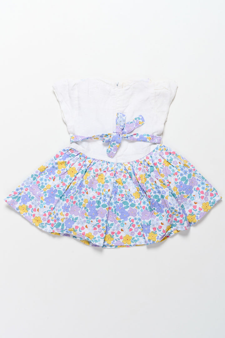 Best Frock Designs for Girls Featuring Multicolored Floral Cotton Skirt and White Top