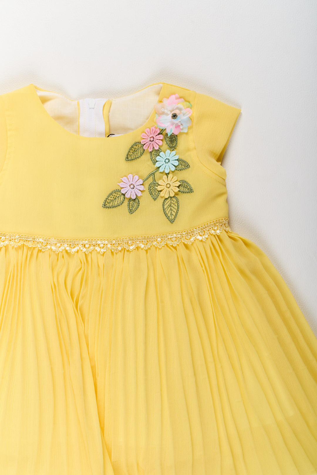 Girls Poly Georgette Frock in Sunshine Yellow with Floral Embellishments and Pleats