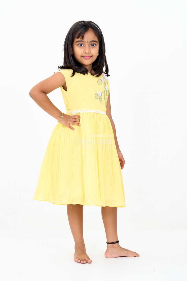 Girls Poly Georgette Frock in Sunshine Yellow with Floral Embellishments and Pleats