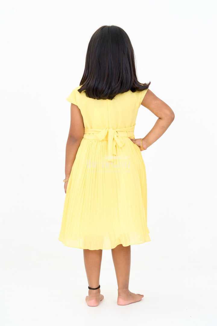 Girls Poly Georgette Frock in Sunshine Yellow with Floral Embellishments and Pleats