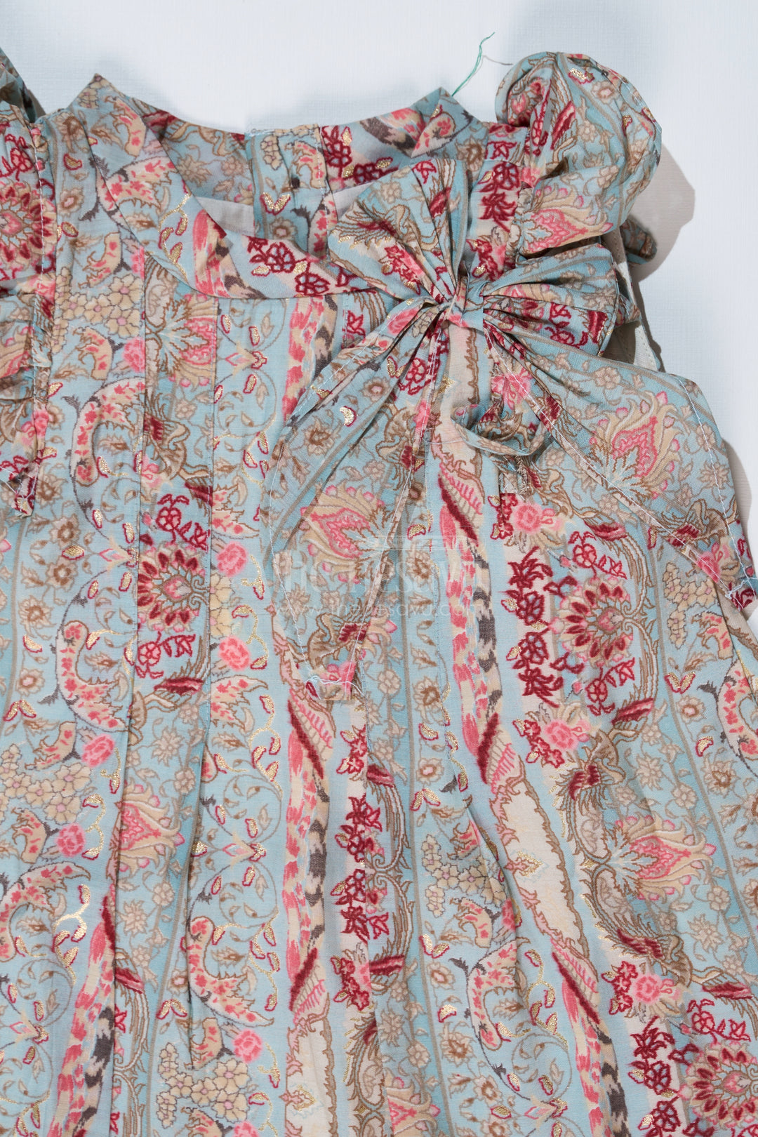 Girls Latest Frock in Muslin Silk with Intricate Print and Decorative Bow