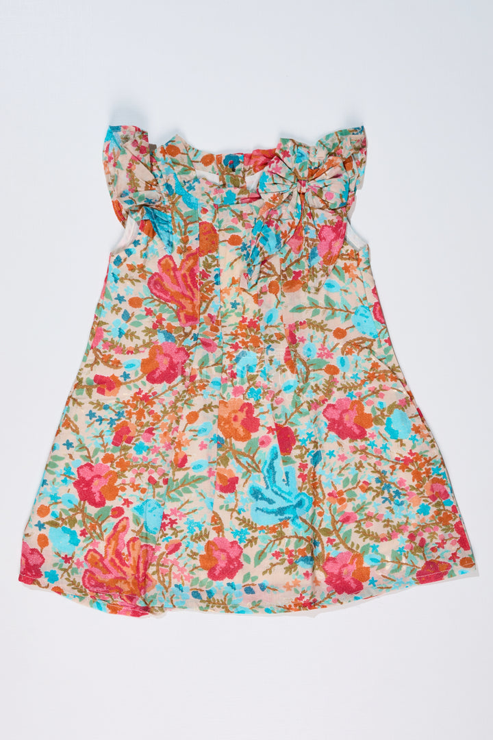 Girls Printed Frock in Muslin Silk with Vibrant Floral Patterns and Stylish Bow