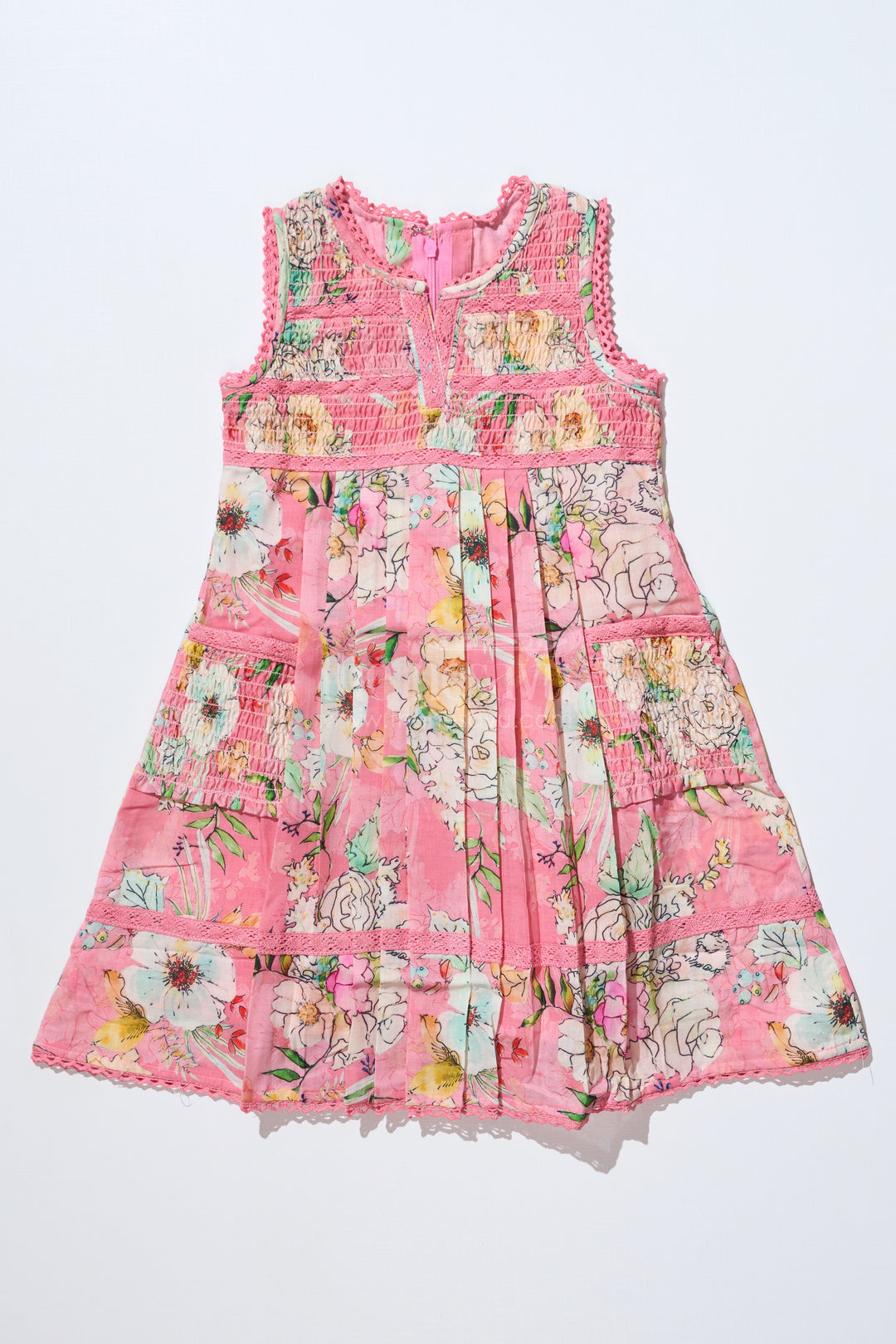 Girls Frock with Flowers in Soft Cotton Featuring Delicate Smocking and Pleated Detailing