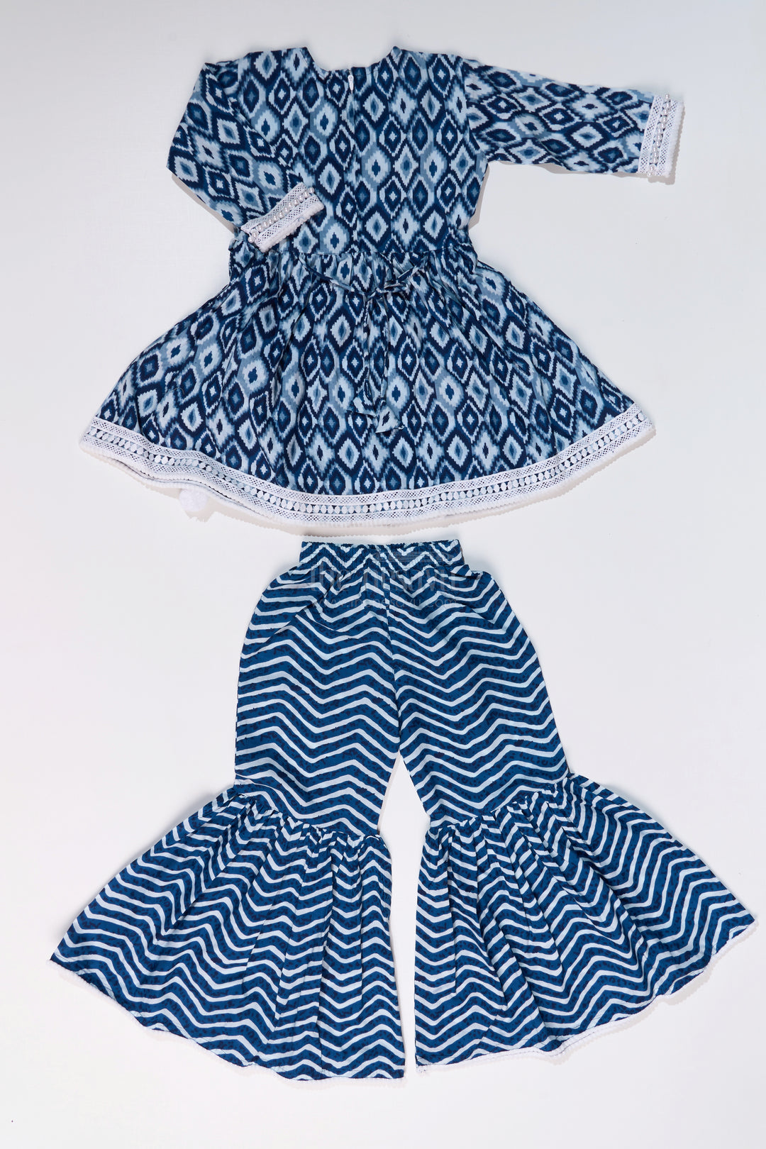 Girls Suit Plazo Set with Ikat Inspired Print and Pom-Pom Detailing in Blue and White