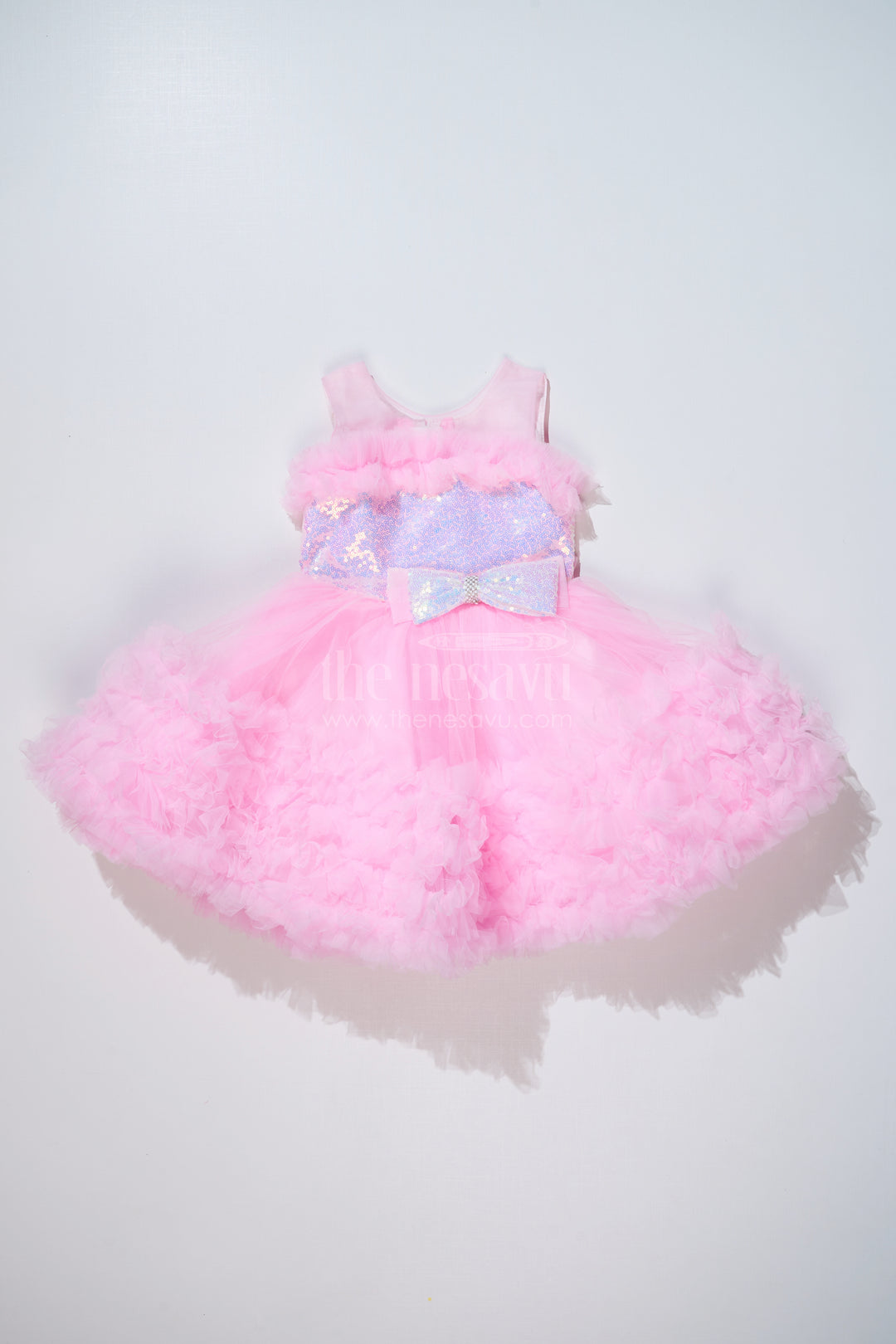 Adorable Pink Net Party Dress for Girls with Ruffled Layers and Sparkling Bow