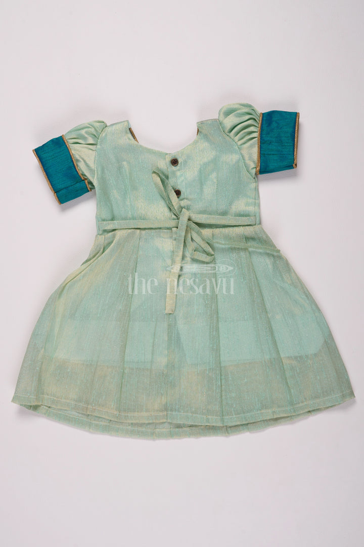 Graceful Light Green Silk Frock Dress for Girls with Elegant Silver Tissue Fabric