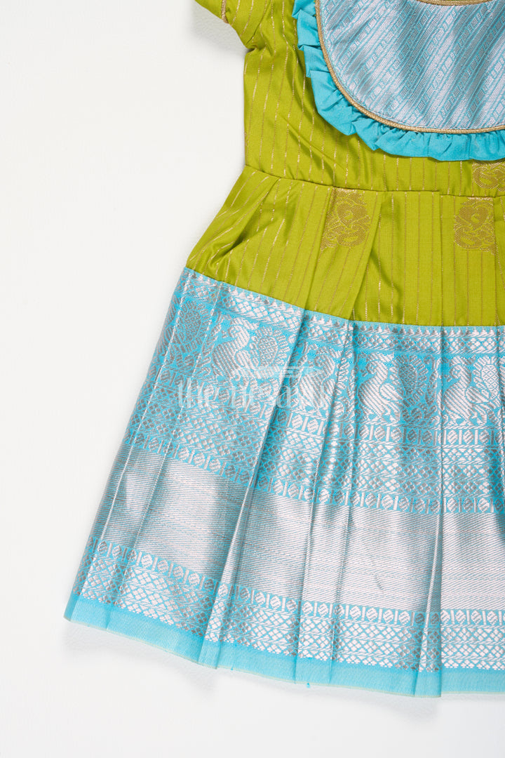 Girls Green Kanchipuram Silk Frock with Blue Zari Border and Puff Sleeves