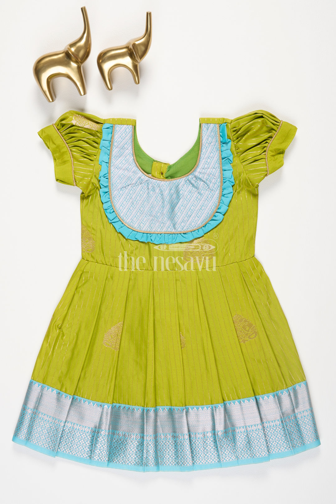 Girls Green Kanchipuram Silk Frock with Blue Zari Border and Puff Sleeves