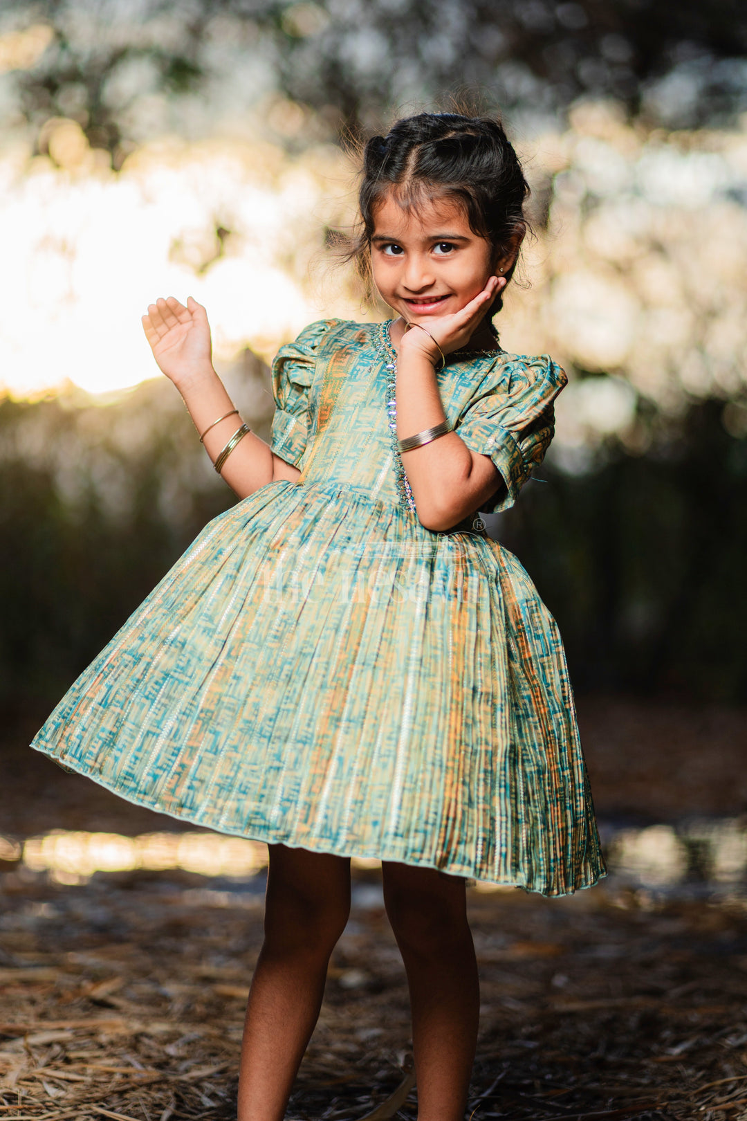 Baby Fancy Frock in Green Tissue Organza with Puff Sleeves and Silver Embellishments