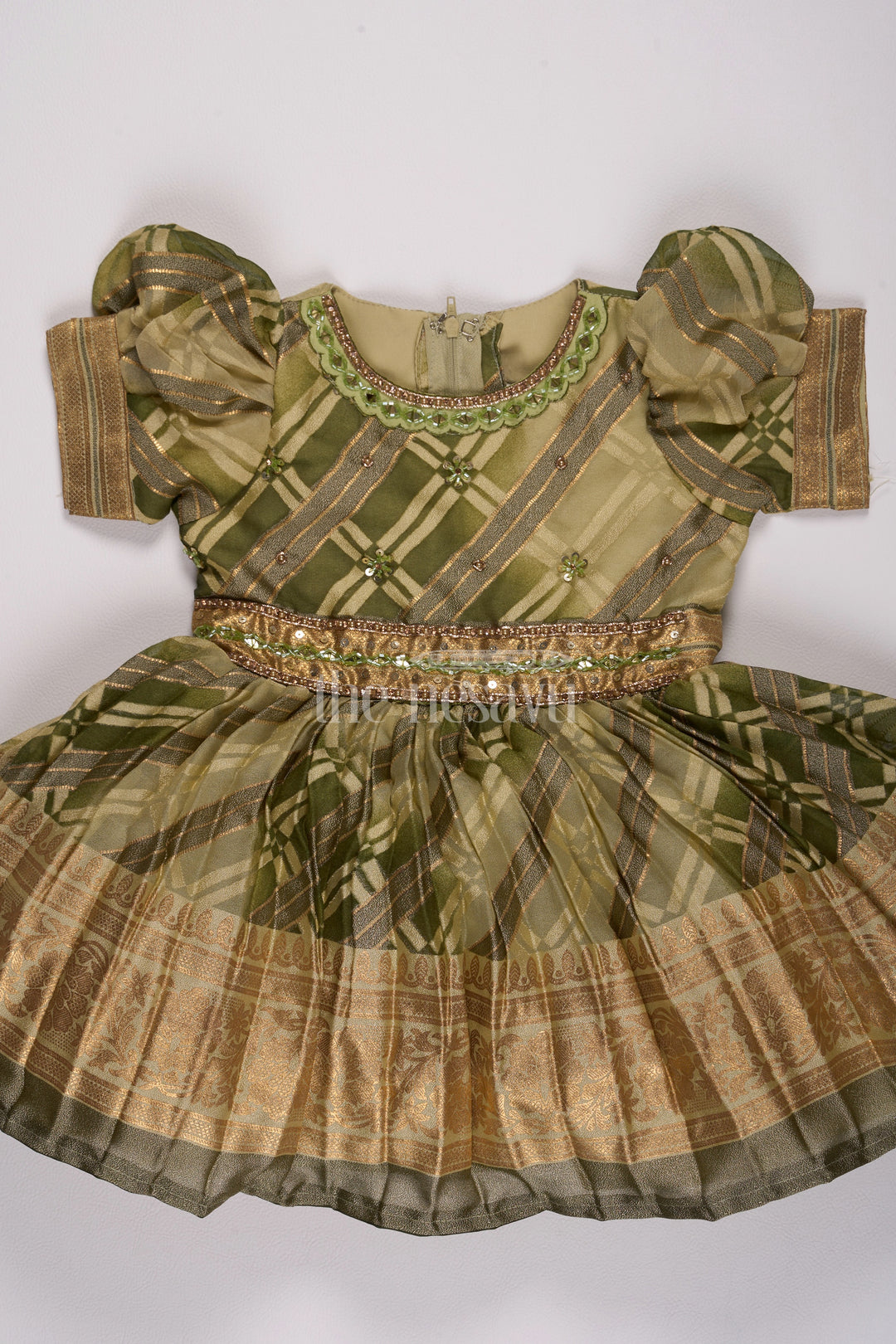 Girls Fancy Frock in Green Tissue Silk with Floral Embellishments and Short Pleated Skirt