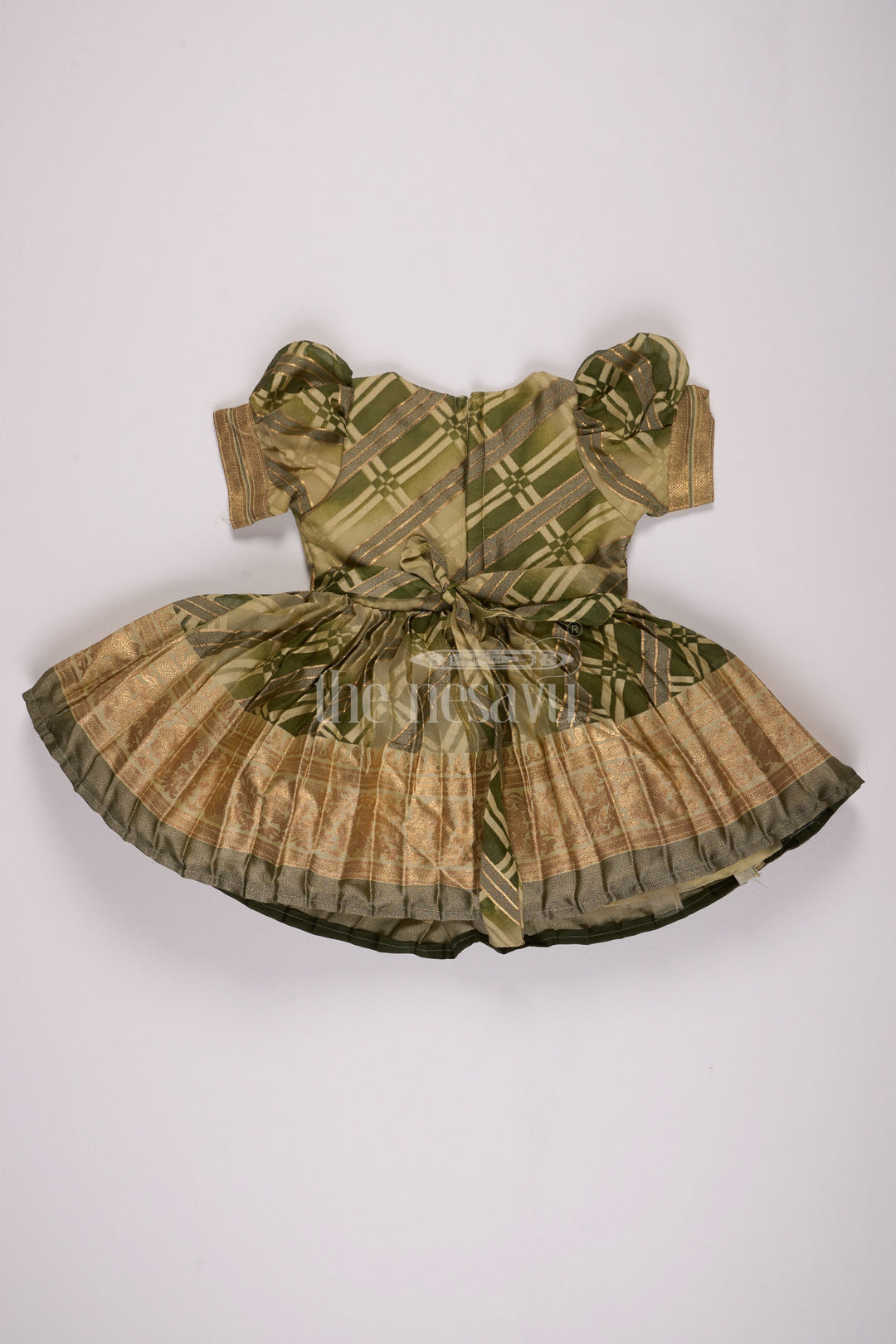 Girls Fancy Frock in Green Tissue Silk with Floral Embellishments and Short Pleated Skirt