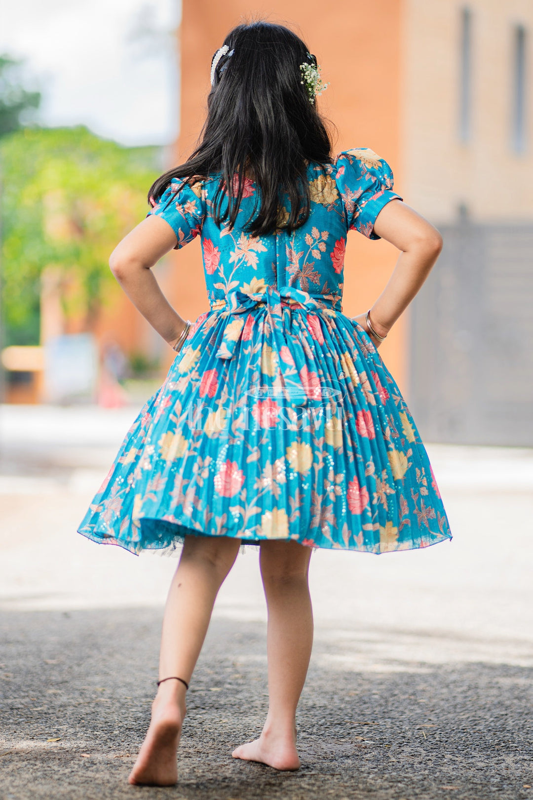 Girls Blue Floral Silk Party Frock with Puff Sleeves and Embellished Waistline