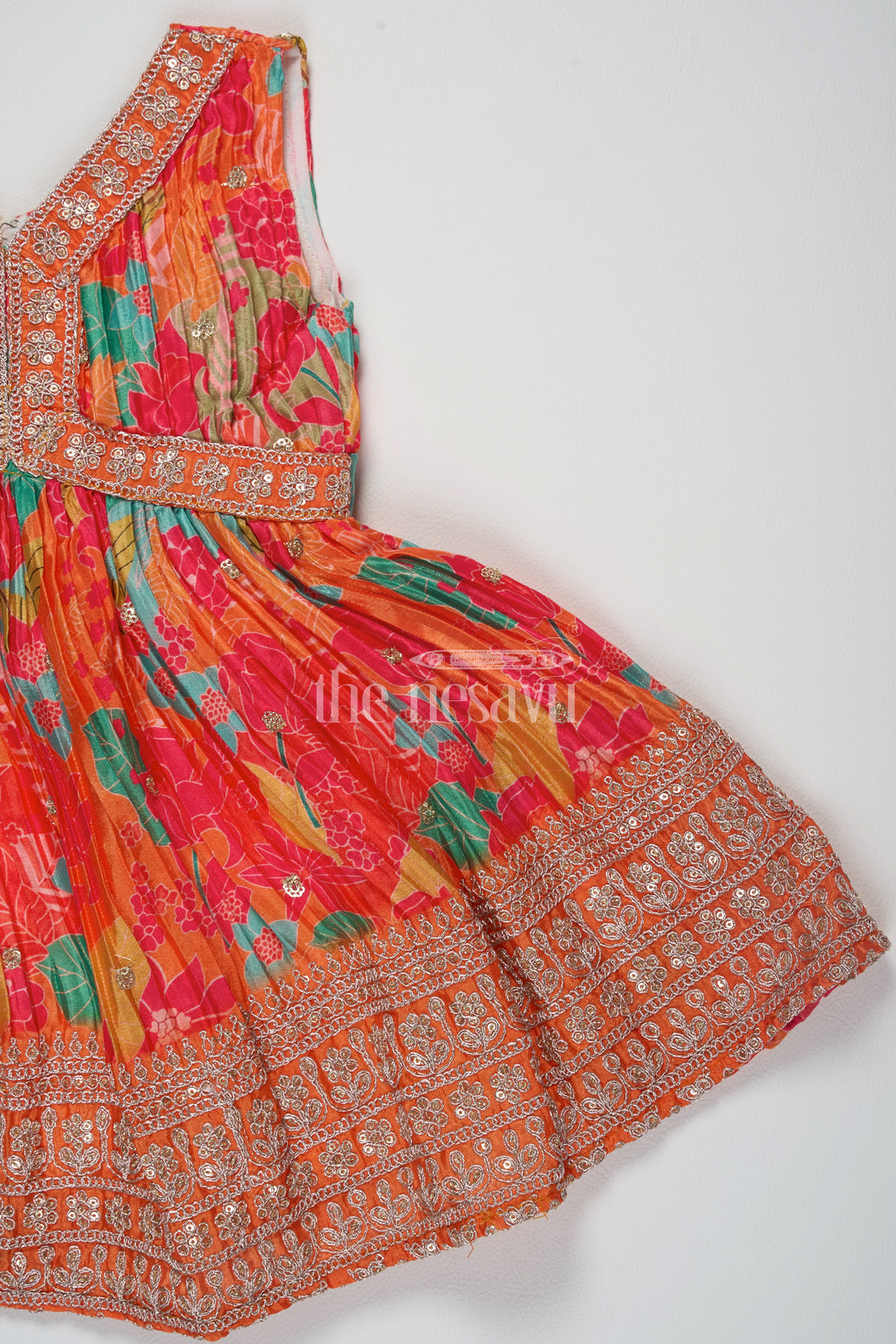 Orange Silk Party Frock for Girls – Traditional Pattu Dress with Floral Prints and Sequins