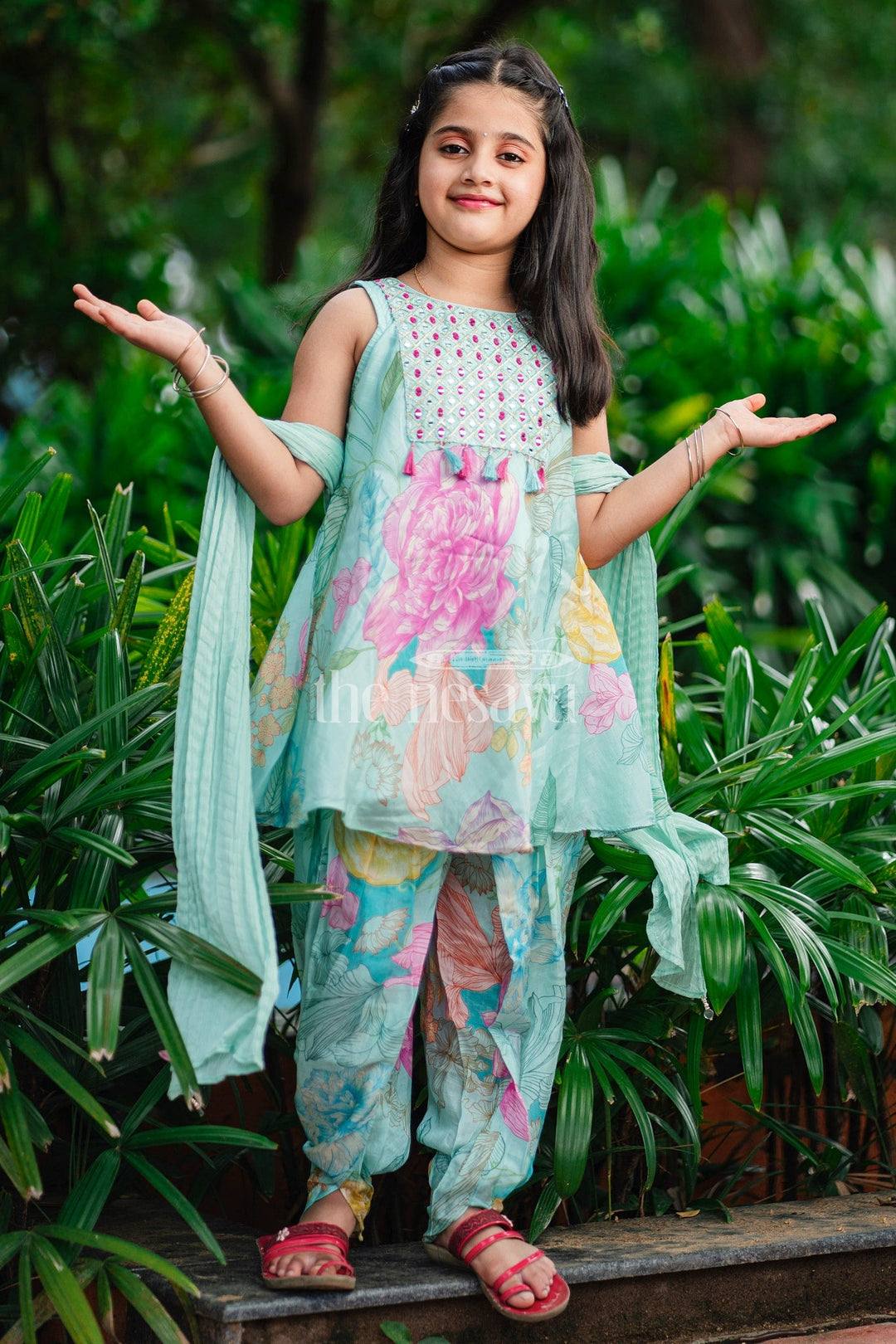 The Nesavu Girls Dothi Sets Aqua Floral Kurta and Dhoti Set for Girls with Sleeveless Kurta and Embellished Yoke Nesavu Nesavu Aqua Floral Girls Dhoti Set Sleeveless Kurta Tassel Embellishments