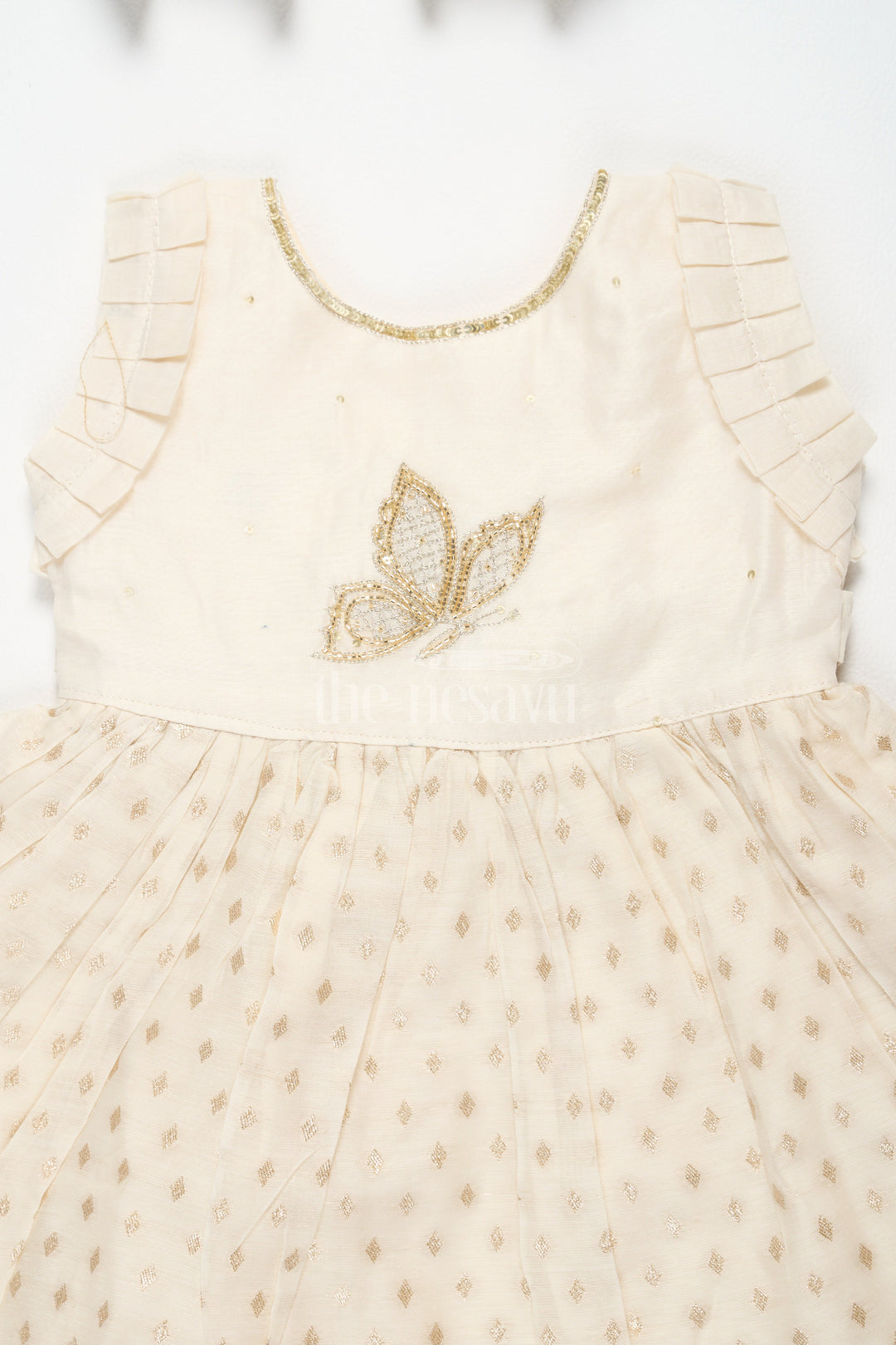 The Nesavu Girls Cotton Frock Baby Fancy Frock in Cream with Golden Accents and Ruffled Sleeves Nesavu Nesavu Baby Fancy Frock Cream Golden Butterfly Motif Ruffled Hem