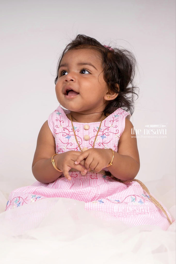 Baby in white cotton frock with pink and blue floral print | Kids fashion  dress, Cotton frocks, Pattu pavadai designs