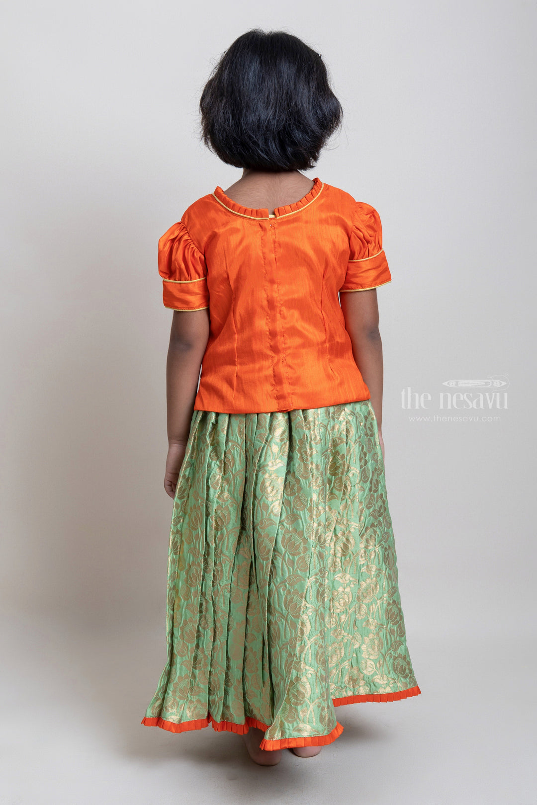 The Nesavu Pattu Pavadai Beautiful Traditional Orange Silk Blouse With Green Pleated Designer Pattu Pavadai Nesavu Silk Pavada For Girls | Premium Silk Frock Onine | The Nesavu