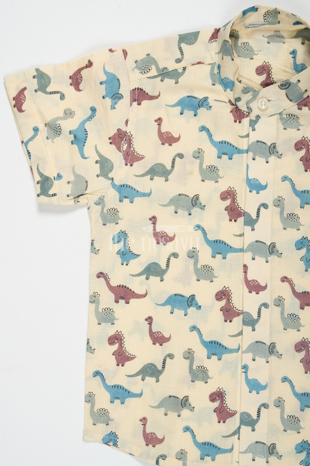 The Nesavu Boys Cotton Shirt Beige Boys Cotton Shirt with Dinosaur Print Half Sleeves Playful and Comfortable Fit Nesavu Beige Dinosaur Print Boys Cotton Shirt Nesavu Playful Half Sleeves Comfortable Casual Wear