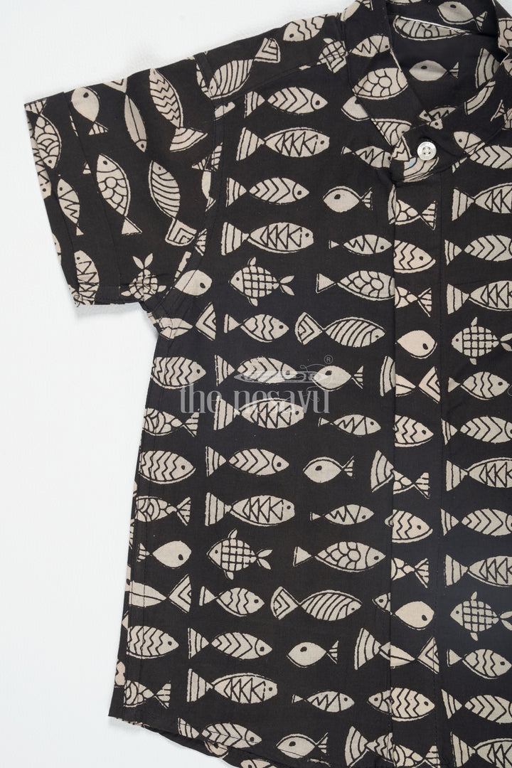 The Nesavu Boys Cotton Shirt Black Boys Ajarak Block Printed Cotton Shirt with Fish Print Half Sleeves for Festive Wear Nesavu Black Ajarak Block Print Boys Cotton Shirt Nesavu Fish Print Half Sleeves Festive Wear