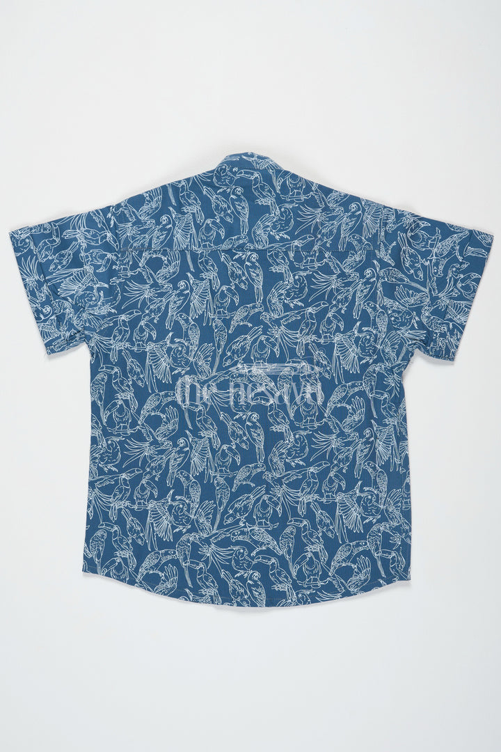 The Nesavu Boys Cotton Shirt Blue Boys Cotton Half Jeans Shirt with Bird Print Half Sleeves Casual and Stylish Nesavu Blue Bird Print Boys Cotton Half Jeans Shirt Nesavu Trendy Half Sleeves Casual Wear Family Outings