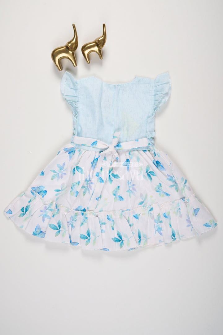 The Nesavu Girls Cotton Frock Blue Butterfly and Leaf Print Cotton Frock with Flutter Sleeves for Girls Nesavu Blue Butterfly and Leaf Print Cotton Frock with Flutter Sleeves for Girls Nesavu