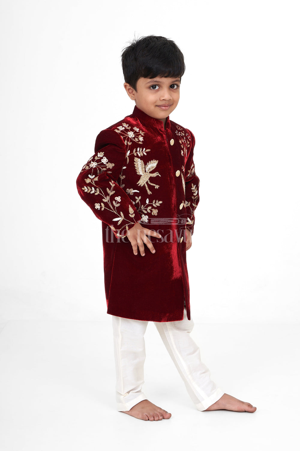 The Nesavu Boys Sherwani Boys Maroon Sherwani Kurta with Intricate Golden Velvet Embroidery and Cream Trousers Nesavu Nesavu Boys Maroon Sherwani Kurta Velvet Golden Embroidery Cream Trousers