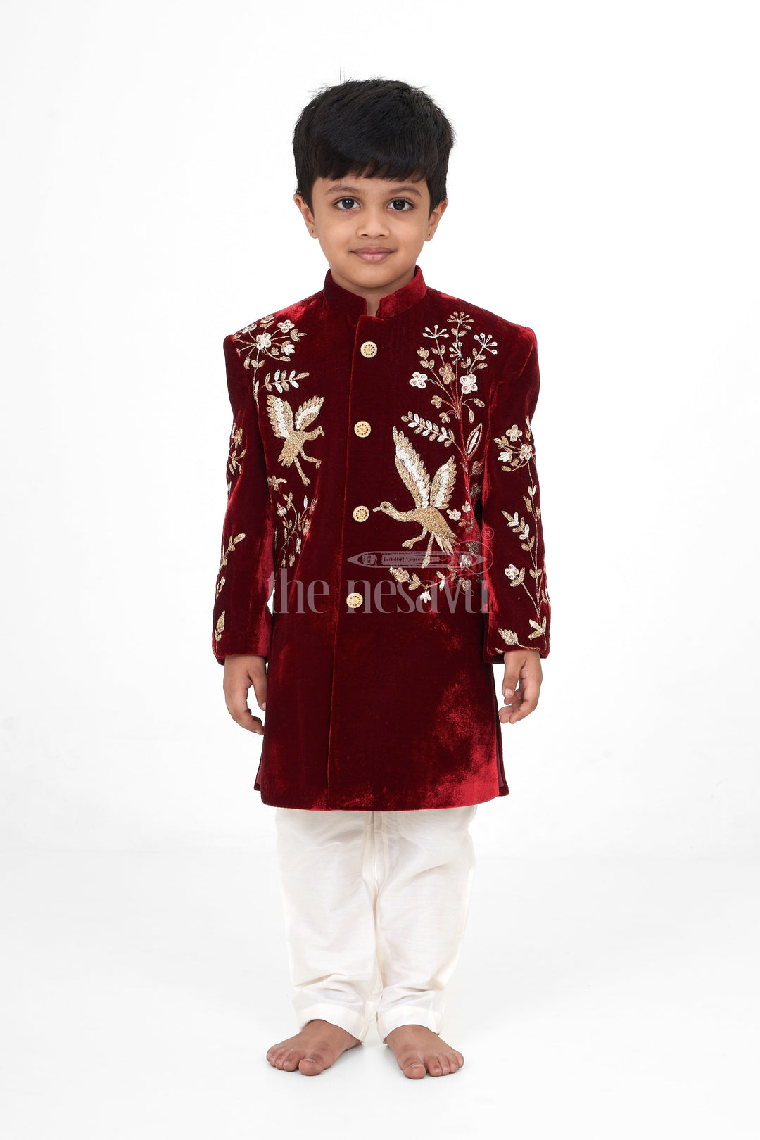 The Nesavu Boys Sherwani Boys Maroon Sherwani Kurta with Intricate Golden Velvet Embroidery and Cream Trousers Nesavu Nesavu Boys Maroon Sherwani Kurta Velvet Golden Embroidery Cream Trousers