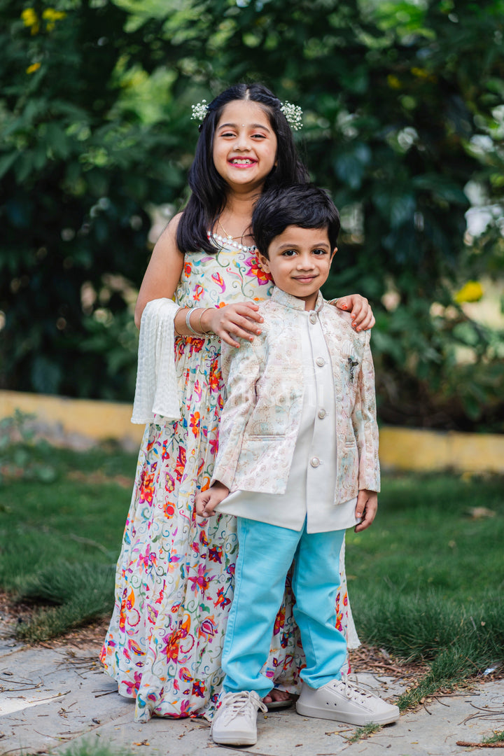 The Nesavu Boys Blazer Set Boys Sherwani Set with Pastel Floral Jacket and Blue Trousers for Weddings and Festivals Nesavu Nesavu Boys Sherwani Set Pastel Floral Jacket Blue Trousers Formal Occasions