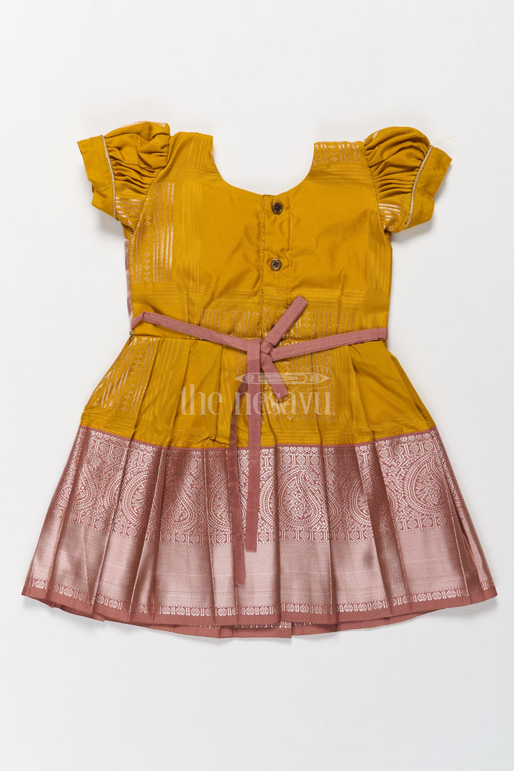 The Nesavu Girls Kanchi Silk Frock Charming Yellow and Brown Girls Kanchi Silk Frock with Traditional Brocade for Pongal Nesavu Yellow Brown Girls Kanchi Silk Frock Pongal Celebrations Nesavu