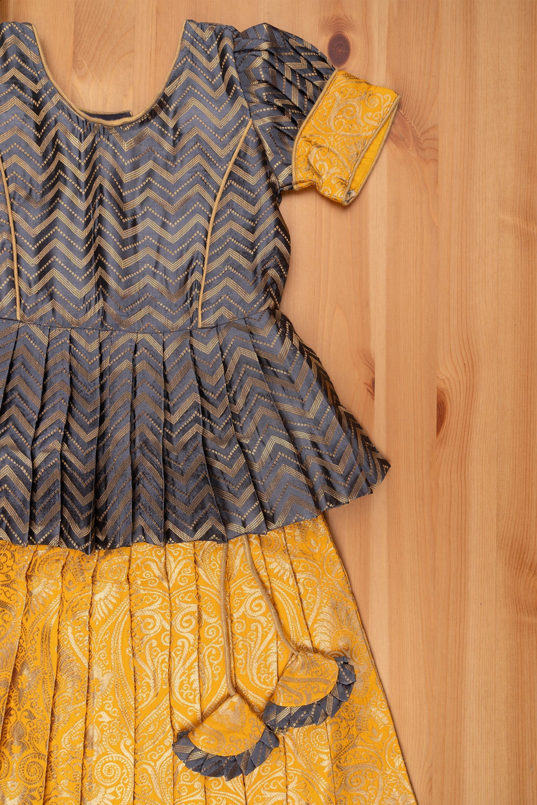 The Nesavu Pattu Pavadai Chic Zig Zag Gray Peplum Top with Banarasi Designer Pattu Pavadai: Festive Delight for Girls Nesavu Banarasi Designer Yellow Pattu Pavadai | Pattu Pavadai New Model | The Nesavu