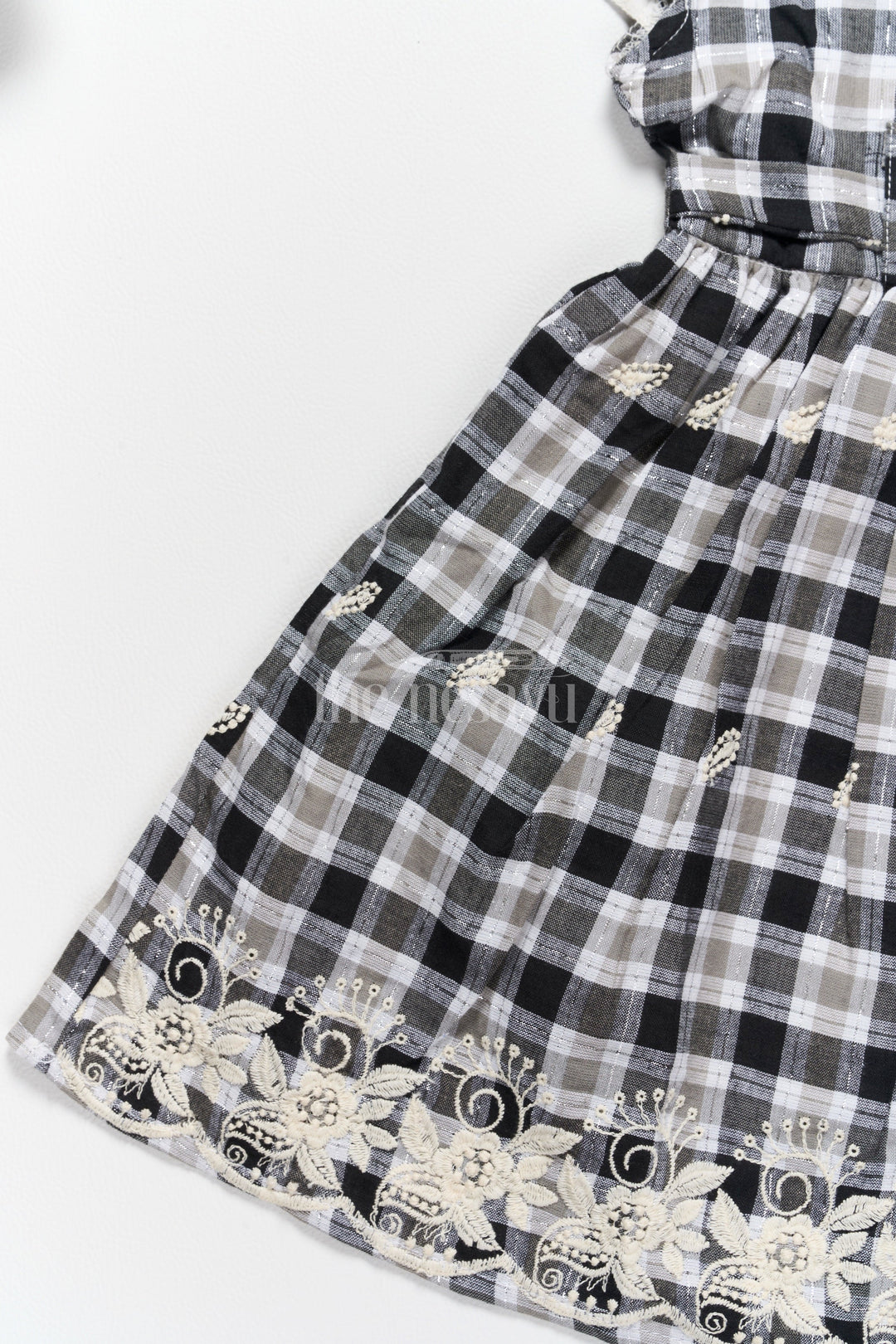 The Nesavu Girls Cotton Frock Classic Black and White Checked Cotton Frock with Lace Hem New Frock Model Nesavu Nesavu Black White Checked Hakoba Cotton Frock Lace Neckline Embroidered Hem