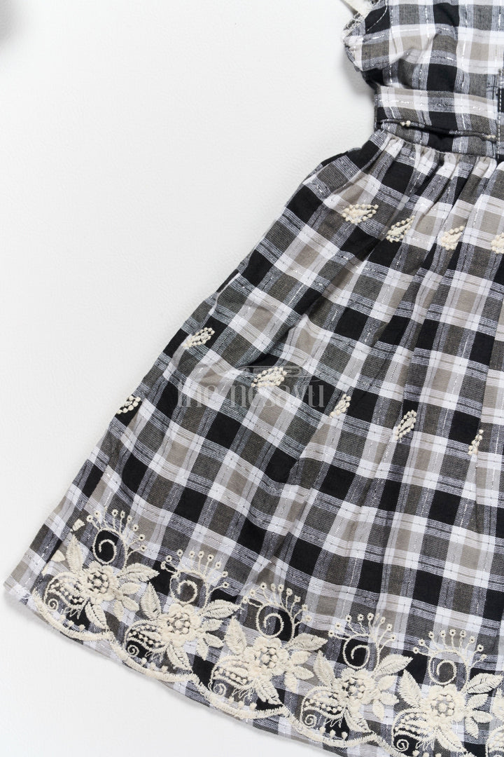 The Nesavu Girls Cotton Frock Classic Black and White Checked Cotton Frock with Lace Hem New Frock Model Nesavu Nesavu Black White Checked Hakoba Cotton Frock Lace Neckline Embroidered Hem