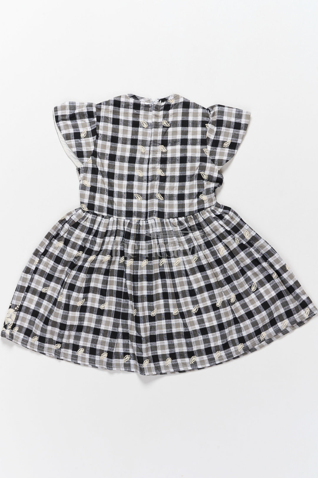 The Nesavu Girls Cotton Frock Classic Black and White Checked Cotton Frock with Lace Hem New Frock Model Nesavu Nesavu Black White Checked Hakoba Cotton Frock Lace Neckline Embroidered Hem