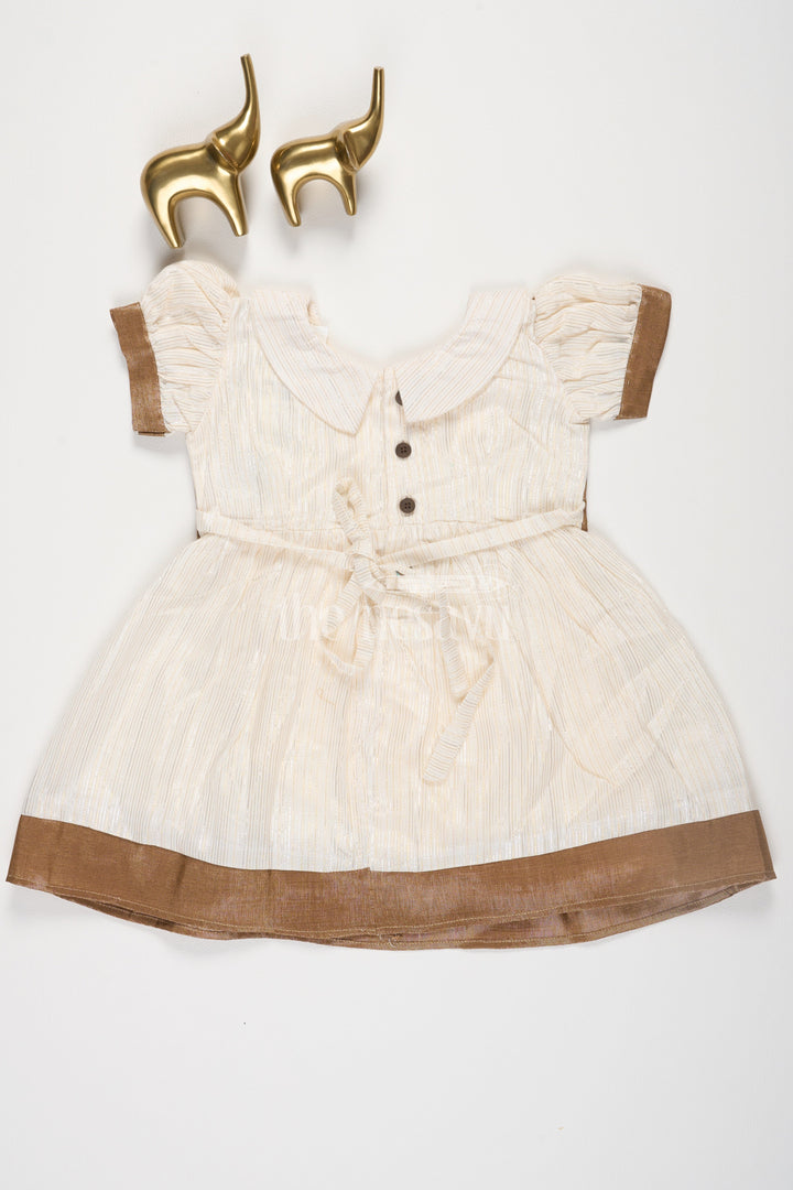 The Nesavu Girls Cotton Frock Cream and Gold Lurex Frock with Cutaway Collar and Waistcoat Jacket for Girls Nesavu Cream and Gold Lurex Frock with Cutaway Collar and Waistcoat Jacket for Girls Nesavu