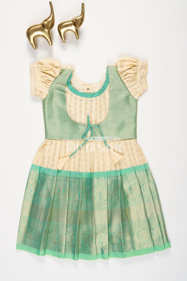 The Nesavu Girls Kanchi Silk Frock Cream and Green Semi Kanchivaram Silk Frock with Golden Stripes and Brocade Border for Girls Nesavu 18 (2Y) / Green / Style 1 SF862BA-18 Nesavu Cream Green Semi Kanchivaram Silk Frock Brocade Border Puff Sleeves Girls