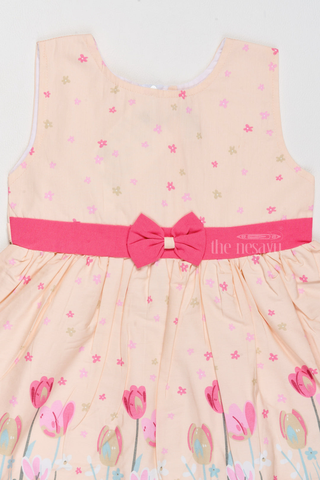 The Nesavu Baby Cotton Frocks Daily Wear Cotton Dress for Girls with Tulip Prints and Decorative Bow Nesavu Nesavu Daily Wear Cotton Girls Dress Tulip Prints Decorative Bow Playdates