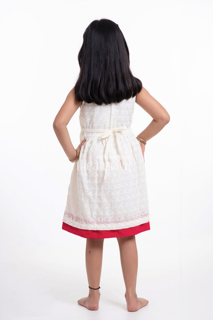 The Nesavu Girls Casual Gown Elegant Bacchon Ka Frock - Sleeveless Chikankari Baby Dress with Red Bow Nesavu Elegant Bacchon Ka Frock - Nesavu | Chikankari Baby Dress with Red Bow