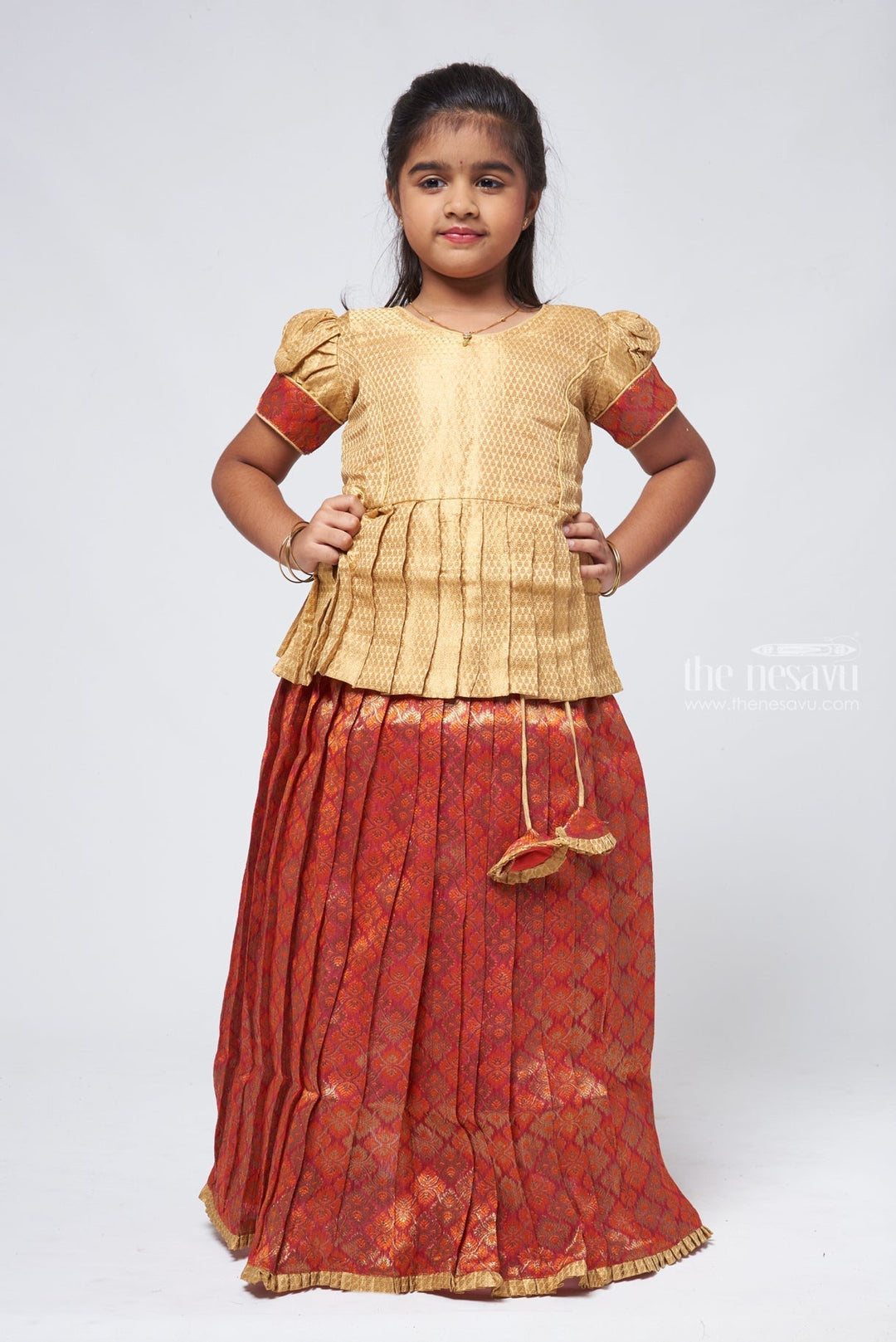 The Nesavu Pattu Pavadai Elegant Brocade Peplum Blouse paired with Zari Floral Designer Pattu Pavadai: Traditional Festive Wear Nesavu 14 (6M) / Beige GPP298A-14 Zari Floral Pattu Pavadai | Pattu Pavadai Sattai Designs | The Nesavu