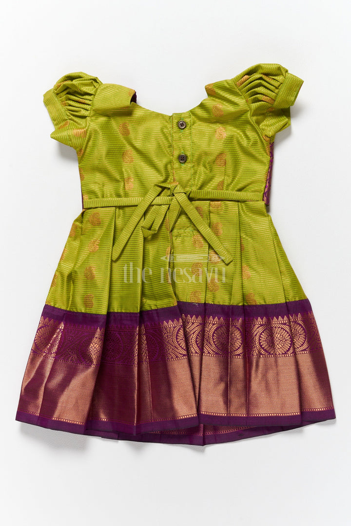 The Nesavu Girls Kanchi Silk Frock Elegant Girls Kanchi Silk Frock with Intricate Purple Border for Pongal Dressing Nesavu Pongal Special Girls Kanchi Silk Frock Lime Green Purple Design Nesavu