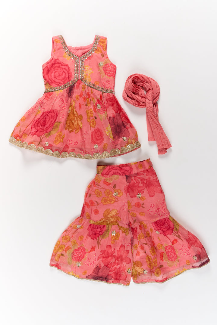 The Nesavu Girls Sharara / Plazo Set Exquisite Girls Bridal Sharara Dress in Red with Printed Organza and Delicate Floral Embellishments Nesavu Nesavu Girls Bridal Sharara Dress Printed Organza Vibrant Red Floral Motifs Dupatta