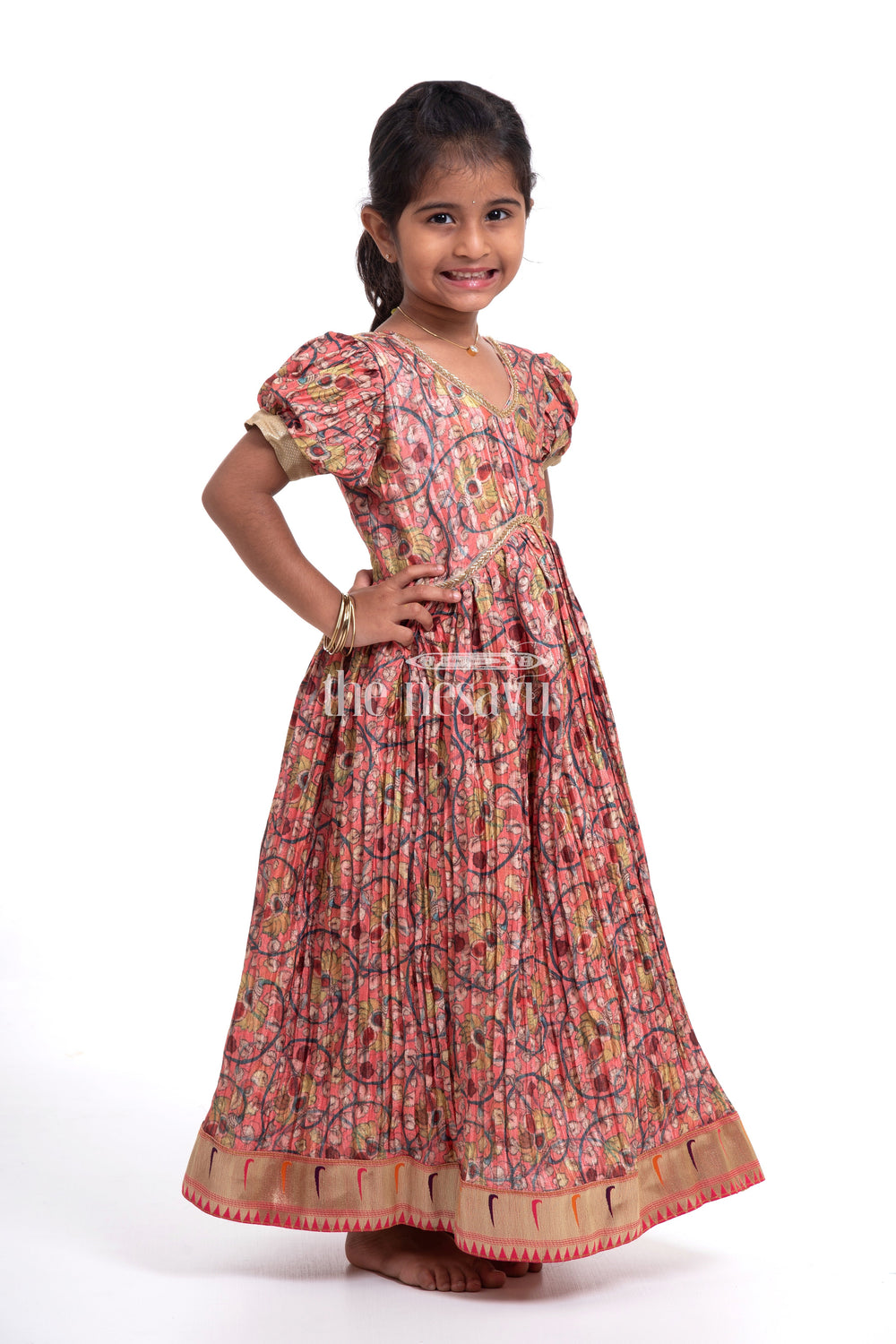 The Nesavu Girls Silk Gown Festive Orange Kalamkari Chinon Party Gown for Girls Nesavu Festive Orange Kalamkari Chinon Party Gown for Girls - Elegant & Comfortable